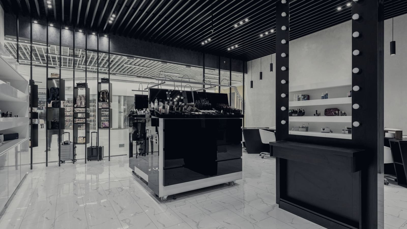 Dark, high-end retail store interior with illuminated display counters