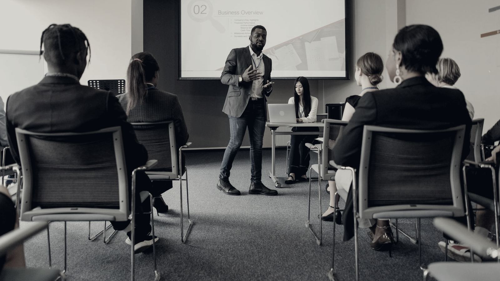 Instructor presenting to seated participants in a training room